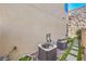 Home exterior with stone landscaping, grass, a walkway and two AC units at 414 Tranquil Peak Ct, Henderson, NV 89012