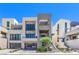 Modern three-story home boasts clean lines, large windows, two-car garage, and minimalist landscaping at 414 Tranquil Peak Ct, Henderson, NV 89012