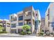 Contemporary multi-level home features a gated entrance, landscaped front yard, and modern architectural details at 414 Tranquil Peak Ct, Henderson, NV 89012