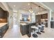 Stylish kitchen island with seating, sleek countertops, stainless steel appliances, and modern lighting at 414 Tranquil Peak Ct, Henderson, NV 89012