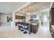 Modern kitchen with bar stool seating, stainless steel appliances, custom cabinetry, and recessed lighting at 414 Tranquil Peak Ct, Henderson, NV 89012