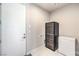 This laundry room has a wine fridge, extra freezer and direct access to the outside at 414 Tranquil Peak Ct, Henderson, NV 89012