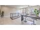 Home office located in a loft area with large windows, built-in desk, and comfortable seating at 414 Tranquil Peak Ct, Henderson, NV 89012