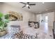 Upstairs den/office with sliding doors, large desk, and unique chairs at 414 Tranquil Peak Ct, Henderson, NV 89012
