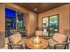 Inviting patio with cozy fire pit and comfortable seating, perfect for enjoying outdoor evenings at 414 Tranquil Peak Ct, Henderson, NV 89012