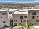 Back exterior of the home featuring a low maintenance yard and desert landscape at 414 Tranquil Peak Ct, Henderson, NV 89012