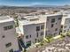 View of the rear exterior featuring a low maintenance yard and desert landscape at 414 Tranquil Peak Ct, Henderson, NV 89012