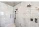 Shower features marble tiling, dual shower heads, and modern controls at 414 Tranquil Peak Ct, Henderson, NV 89012