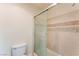 A bathroom with a tiled walk-in shower with glass doors and a low flow toilet at 4400 S Jones Blvd # 2033, Las Vegas, NV 89103