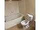 This bathroom features tile floors, a white bathtub and a white toilet with the lid open at 4400 S Jones Blvd # 2033, Las Vegas, NV 89103