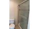 Bathroom with sliding glass shower doors and toilet at 4400 S Jones Blvd # 2033, Las Vegas, NV 89103