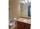 This bathroom features a speckled countertop, a mirror, and a white sink at 4400 S Jones Blvd # 2033, Las Vegas, NV 89103