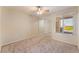 Bedroom with carpet, ceiling fan, and a window with blinds showing a view of the city at 4400 S Jones Blvd # 2033, Las Vegas, NV 89103