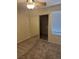 This bedroom features an open closet, grey carpet, neutral walls and a large window at 4400 S Jones Blvd # 2033, Las Vegas, NV 89103
