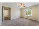 Large bedroom with ceiling fan and view through window to exterior at 4400 S Jones Blvd # 2033, Las Vegas, NV 89103