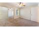 Bedroom with carpet, ceiling fan, and a closet with mirrored doors at 4400 S Jones Blvd # 2033, Las Vegas, NV 89103