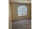 Bedroom featuring neutral carpet and a window offering natural light at 4400 S Jones Blvd # 2033, Las Vegas, NV 89103