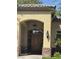 Mediterranean-style entryway with a wooden front door at 4400 S Jones Blvd # 2033, Las Vegas, NV 89103
