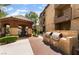 Community grilling area with built in gas grills, covered dining, and desert landscaping at 4400 S Jones Blvd # 2033, Las Vegas, NV 89103