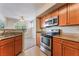 Kitchen with stainless steel appliances and view to living area at 4400 S Jones Blvd # 2033, Las Vegas, NV 89103