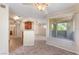 Inviting living room with open floor plan, neutral carpet, and large window at 4400 S Jones Blvd # 2033, Las Vegas, NV 89103