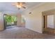 Bright living room with sliding glass doors to balcony and neutral carpet at 4400 S Jones Blvd # 2033, Las Vegas, NV 89103