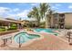 Community pool and hot tub area with inviting brick paver deck and lounge seating at 4400 S Jones Blvd # 2033, Las Vegas, NV 89103