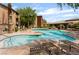 Beautiful community pool with comfortable lounge seating and mature shade trees at 4400 S Jones Blvd # 2033, Las Vegas, NV 89103