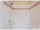 Shower with white tile, a horizontal stripe of pink accent tiles, and a shower head at 4400 S Jones Blvd # 2033, Las Vegas, NV 89103