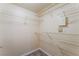 Walk-in closet with wire shelving and neutral walls, offering ample storage space at 4400 S Jones Blvd # 2033, Las Vegas, NV 89103