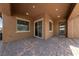 Charming outdoor patio with a tiled floor and a landscaped, low-maintenance backyard at 485 Pebble Run Ave, Henderson, NV 89011