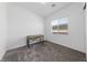 This bedroom features plush carpeting, a window for natural light, and a small desk at 485 Pebble Run Ave, Henderson, NV 89011