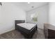 Cozy bedroom with carpet, bed, dresser, and window allowing natural light at 485 Pebble Run Ave, Henderson, NV 89011