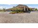 Community clubhouse with well-maintained landscaping and inviting circular driveway at 485 Pebble Run Ave, Henderson, NV 89011