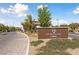 Welcoming entrance sign to the Heritage by Lennar community, showcasing its brick facade and landscaped surroundings at 485 Pebble Run Ave, Henderson, NV 89011