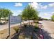 Entrance to 'The Club at Heritage' with manicured landscaping and paver driveway at 485 Pebble Run Ave, Henderson, NV 89011