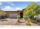 Charming single-story home with well-manicured landscaping and a brick-paved driveway at 485 Pebble Run Ave, Henderson, NV 89011