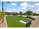 Outdoor horseshoe pits nestled in a grassy area, perfect for leisure and friendly competition at 485 Pebble Run Ave, Henderson, NV 89011