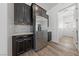 Well-equipped kitchen featuring stainless steel appliances, granite countertops, and dark wood cabinets at 485 Pebble Run Ave, Henderson, NV 89011