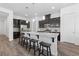 Modern kitchen with stainless steel appliances, granite countertops, and a breakfast bar at 485 Pebble Run Ave, Henderson, NV 89011