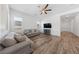 Bright living room with hardwood floors, comfortable seating, and a TV at 485 Pebble Run Ave, Henderson, NV 89011
