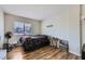Simple bedroom with hardwood floors and natural light at 5502 Cinnamon Ave, Las Vegas, NV 89122