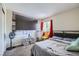 This bedroom features a large TV, a comfortable bed, and lots of room at 5502 Cinnamon Ave, Las Vegas, NV 89122