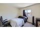 A cozy bedroom featuring a single bed, natural light from the window and comfortable carpeting at 5502 Cinnamon Ave, Las Vegas, NV 89122