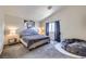 Neutral toned bedroom with plush carpeting, king bed, and bean bag chair at 5502 Cinnamon Ave, Las Vegas, NV 89122