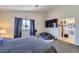 Relaxing bedroom features a king-size bed, TV, and lots of space at 5502 Cinnamon Ave, Las Vegas, NV 89122
