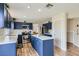 Stylish kitchen features blue cabinetry, stainless steel appliances, and a large island at 5502 Cinnamon Ave, Las Vegas, NV 89122