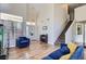 Bright living room with soaring ceilings, wood-look floors, and comfortable seating at 5502 Cinnamon Ave, Las Vegas, NV 89122