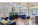 Open-concept living room with vaulted ceilings, wood-look floors, and a large fish tank at 5502 Cinnamon Ave, Las Vegas, NV 89122