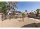 Expansive backyard provides ample space for leisure, enhanced by rock landscaping and patio seating for relaxation at 6436 Deadwood Rd, Las Vegas, NV 89108